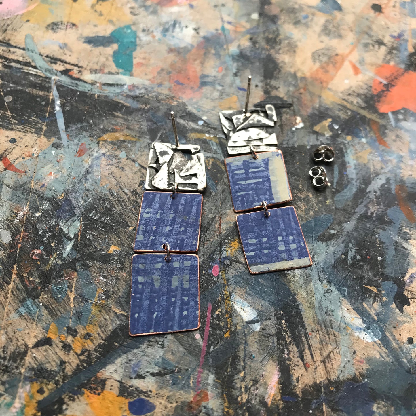 the raw collaged ON THE CUSP earrings with blue stripes
