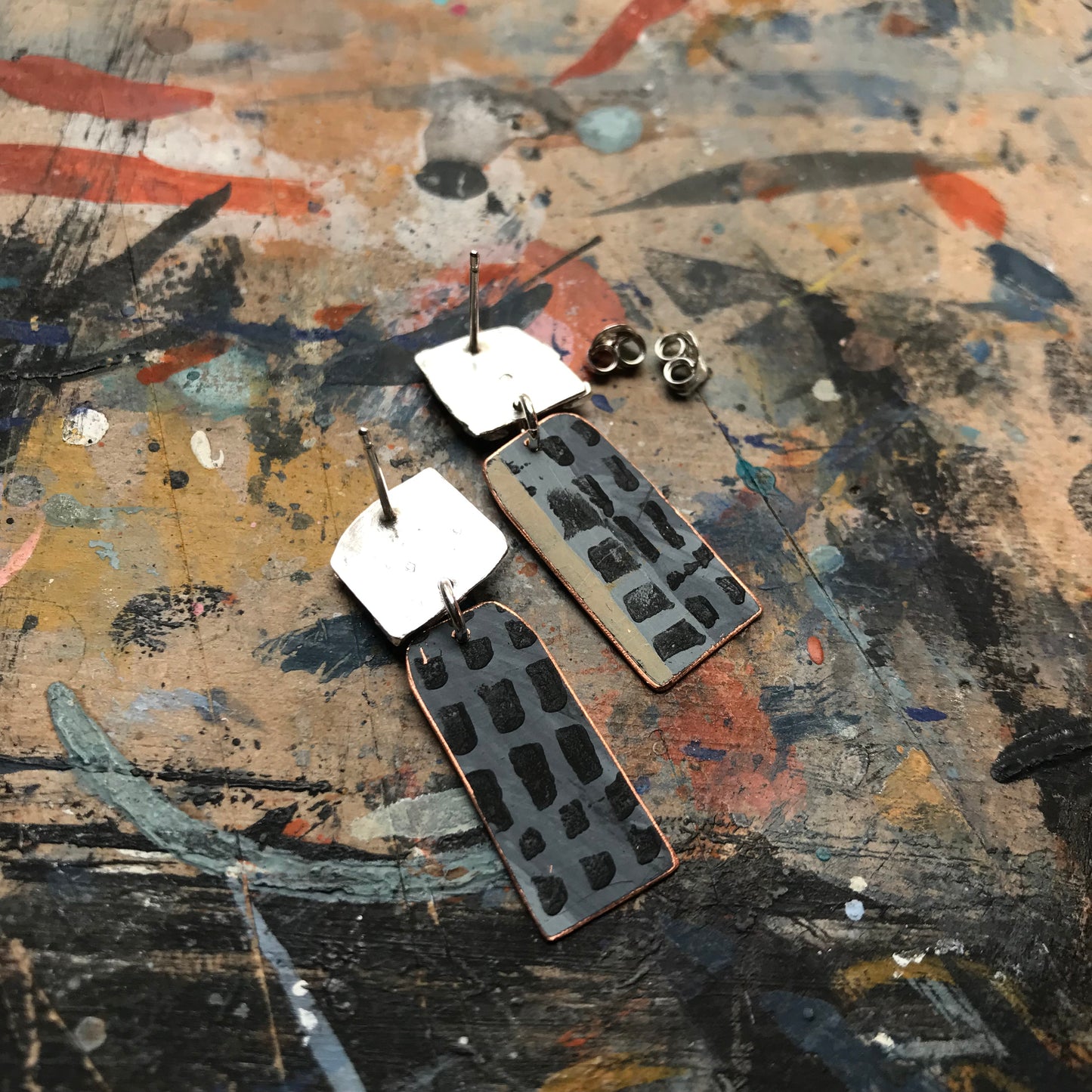 the raw sketch ON THE CUSP earrings with blue grid