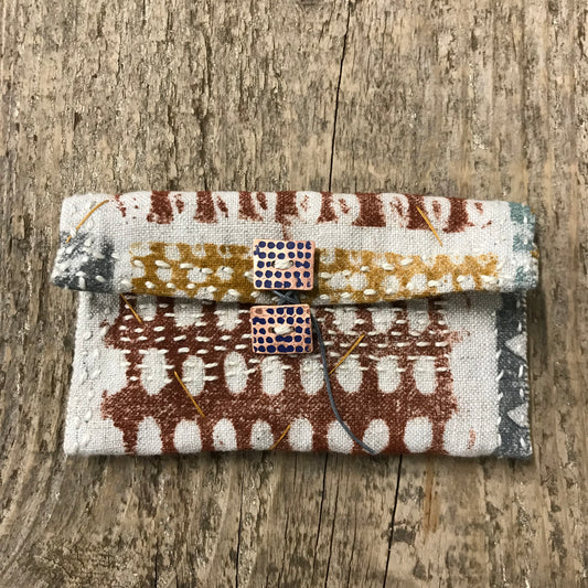 hand stitched keepsake pouch with copper buttons