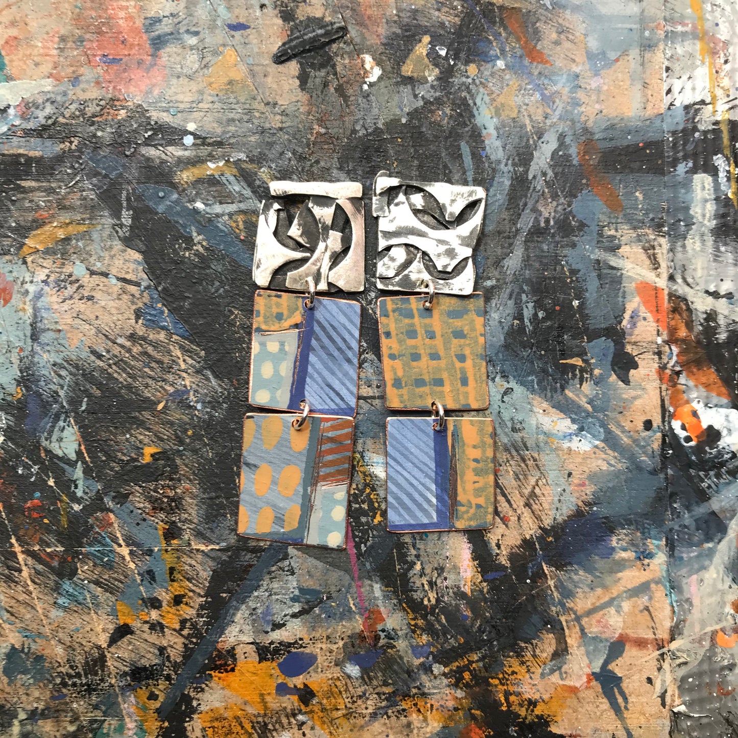 the raw collaged ON THE CUSP earrings with blue stripes