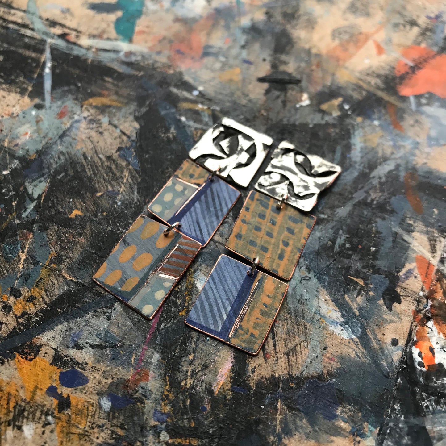 the raw collaged ON THE CUSP earrings with blue stripes