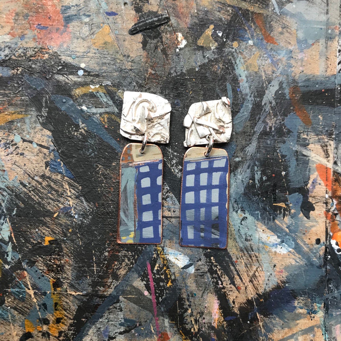 the raw sketch ON THE CUSP earrings with blue grid