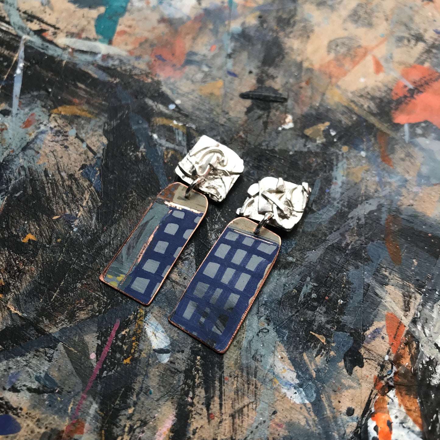 the raw sketch ON THE CUSP earrings with blue grid