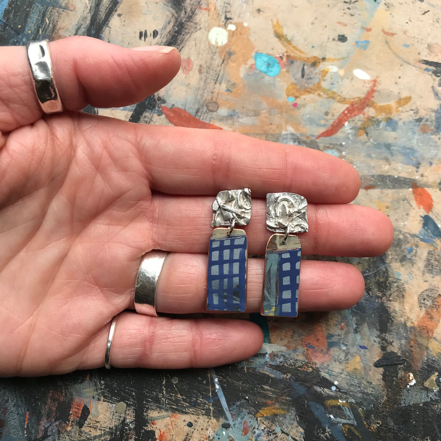 the raw sketch ON THE CUSP earrings with blue grid
