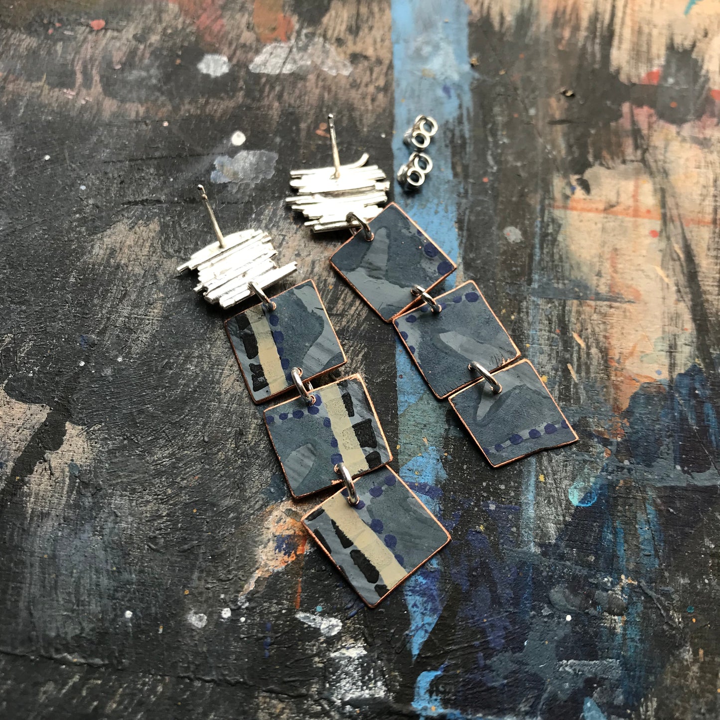 the ON THE CUSP earrings with orange spots & blue waves