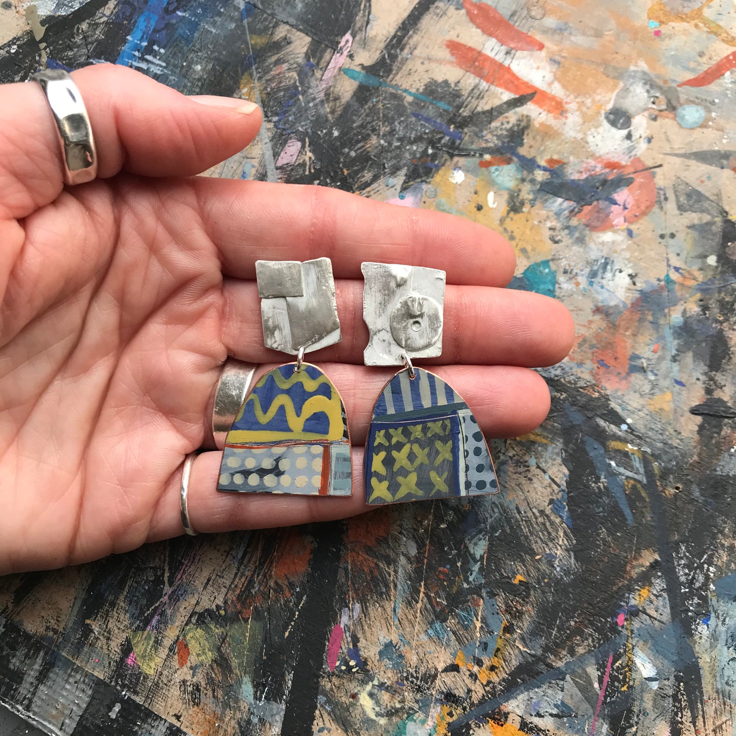 the spontaneous ON THE CUSP earrings with yellow waves
