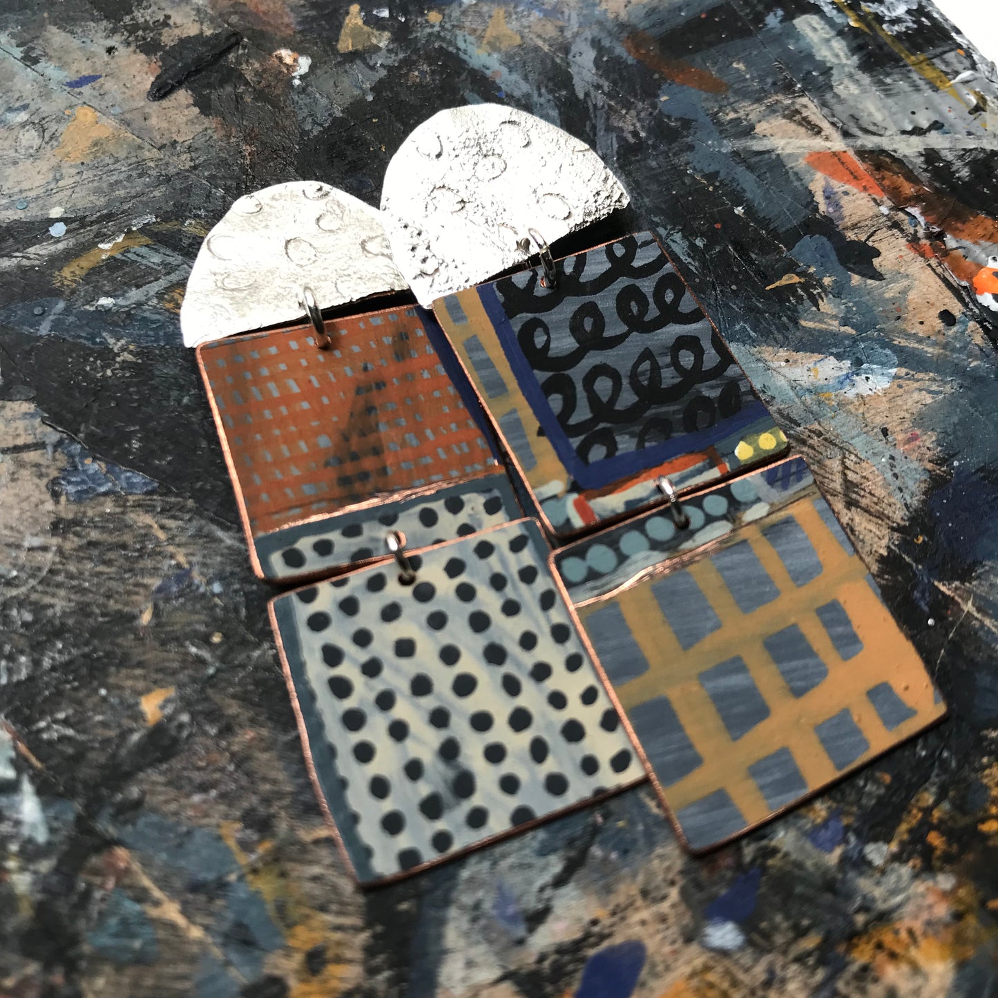 the death defying ON THE CUSP earrings with red & mustard grids