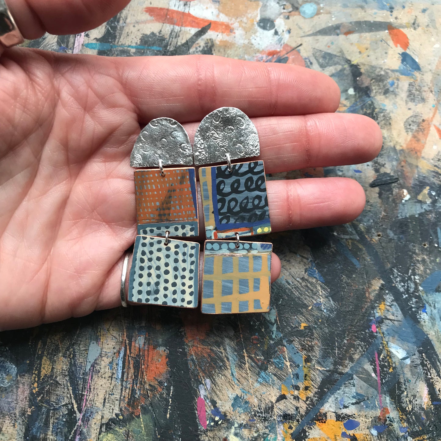 the death defying ON THE CUSP earrings with red & mustard grids