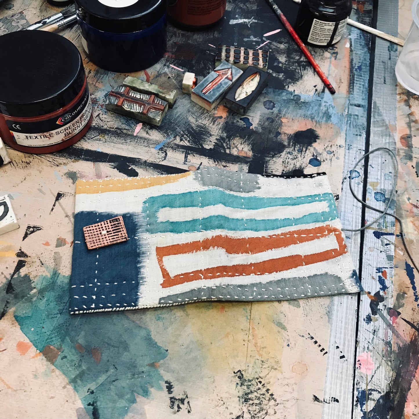 Hand stitched and painted pouch