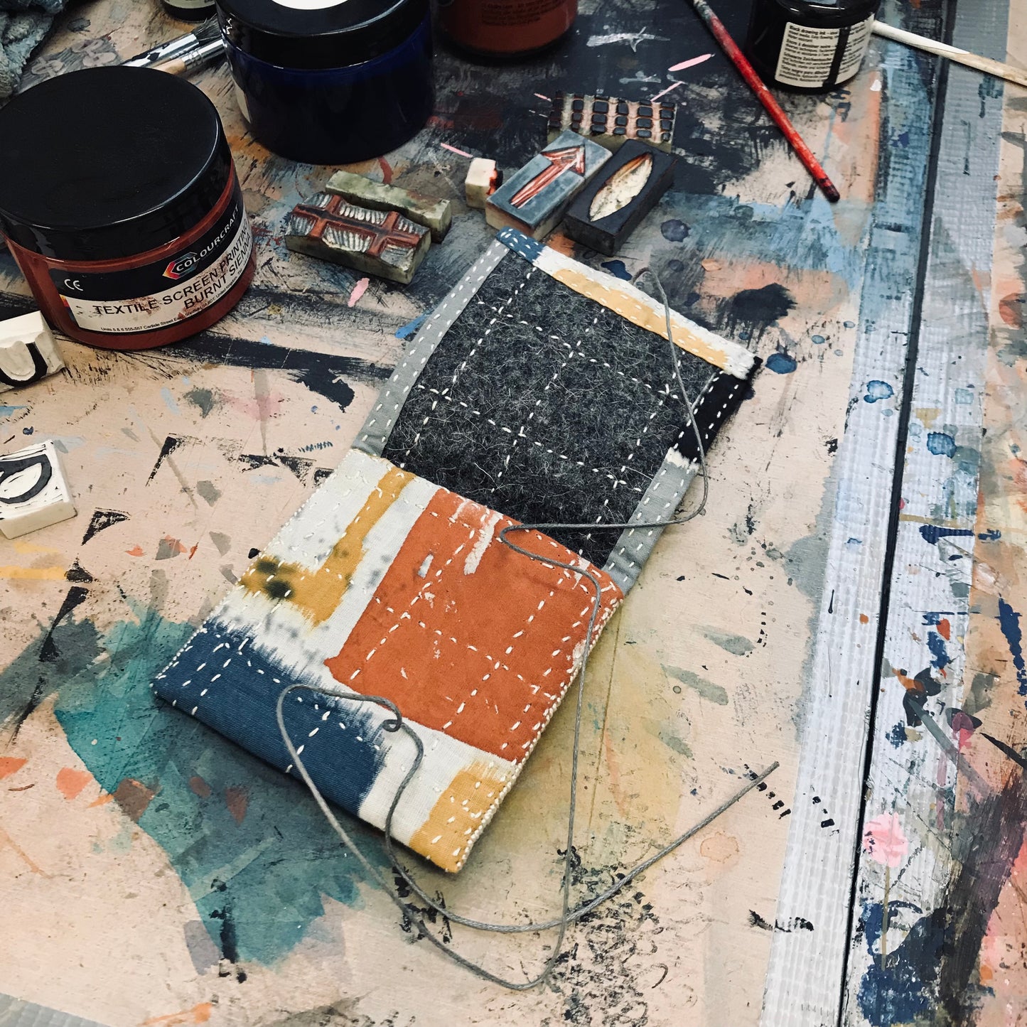 Hand stitched and painted pouch