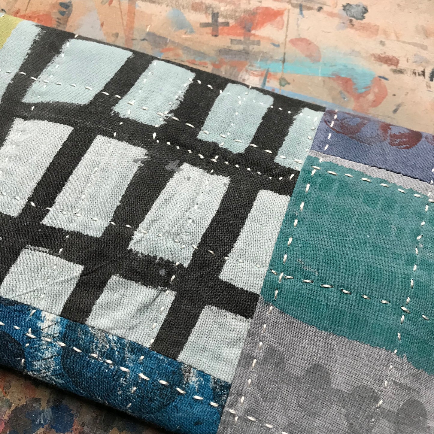the SOFT PATCHWORK pouch with spots and grids