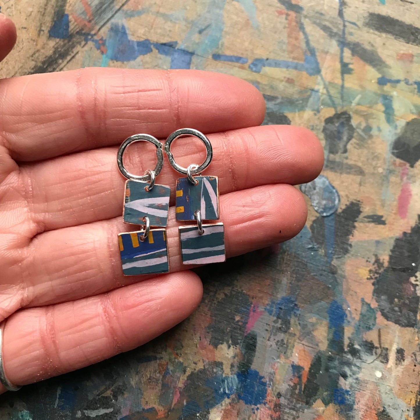 the MEASURED UNFURLING earrings