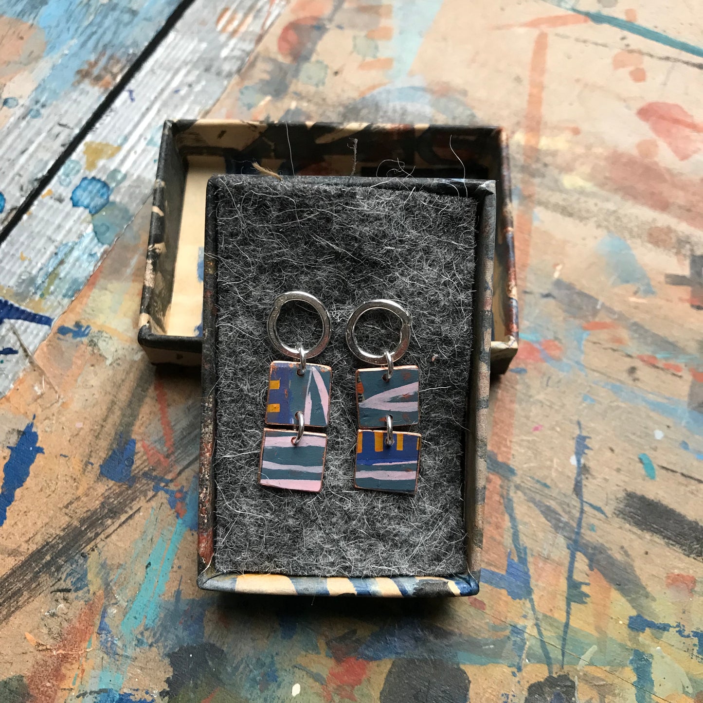 the MEASURED UNFURLING earrings