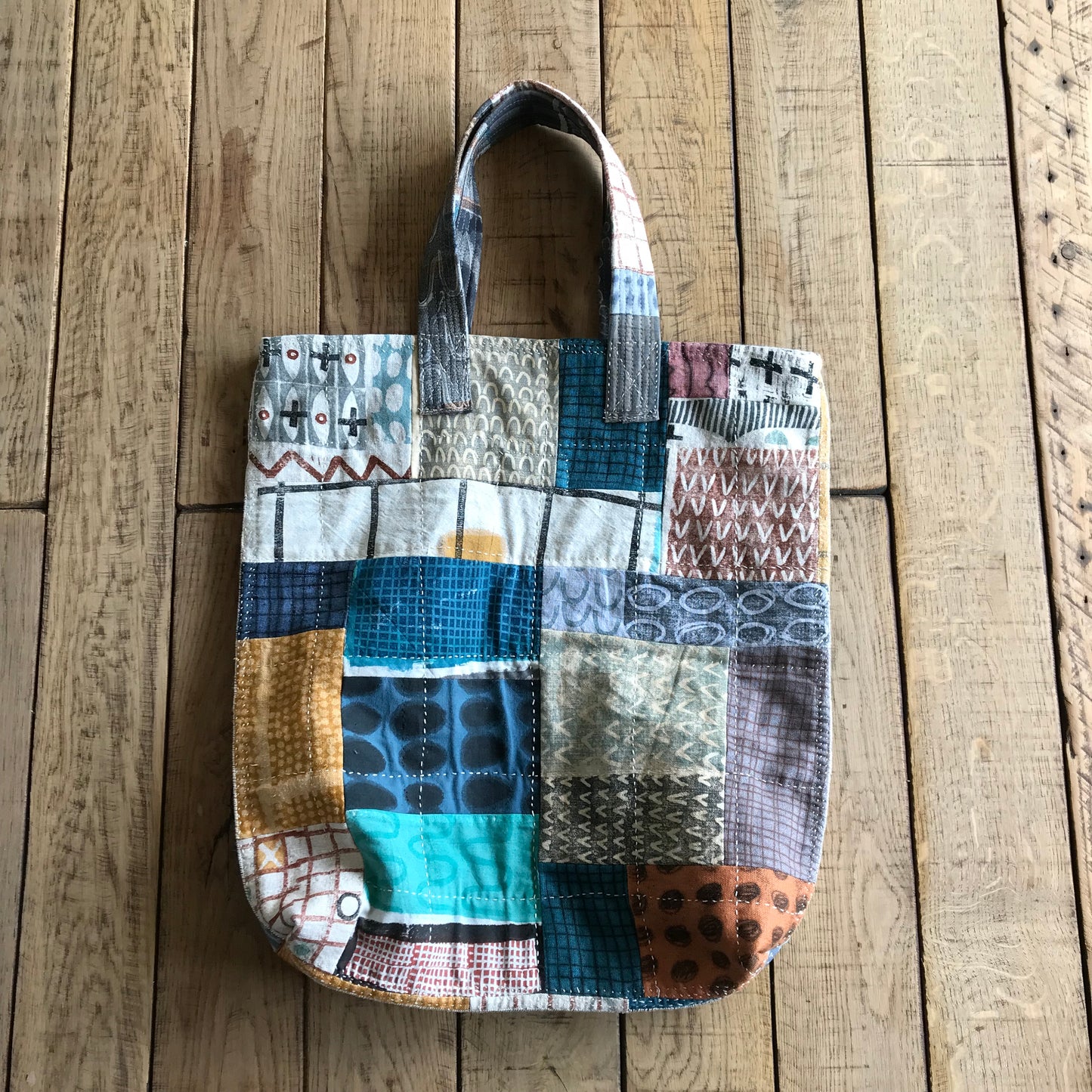 the PATCH WORK GRID WORK bag