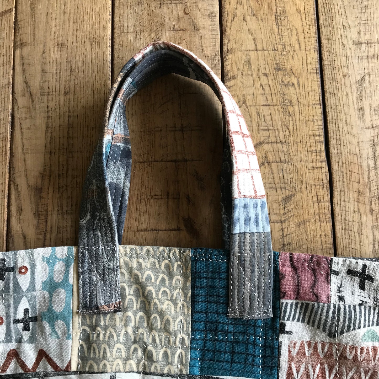 the PATCH WORK GRID WORK bag