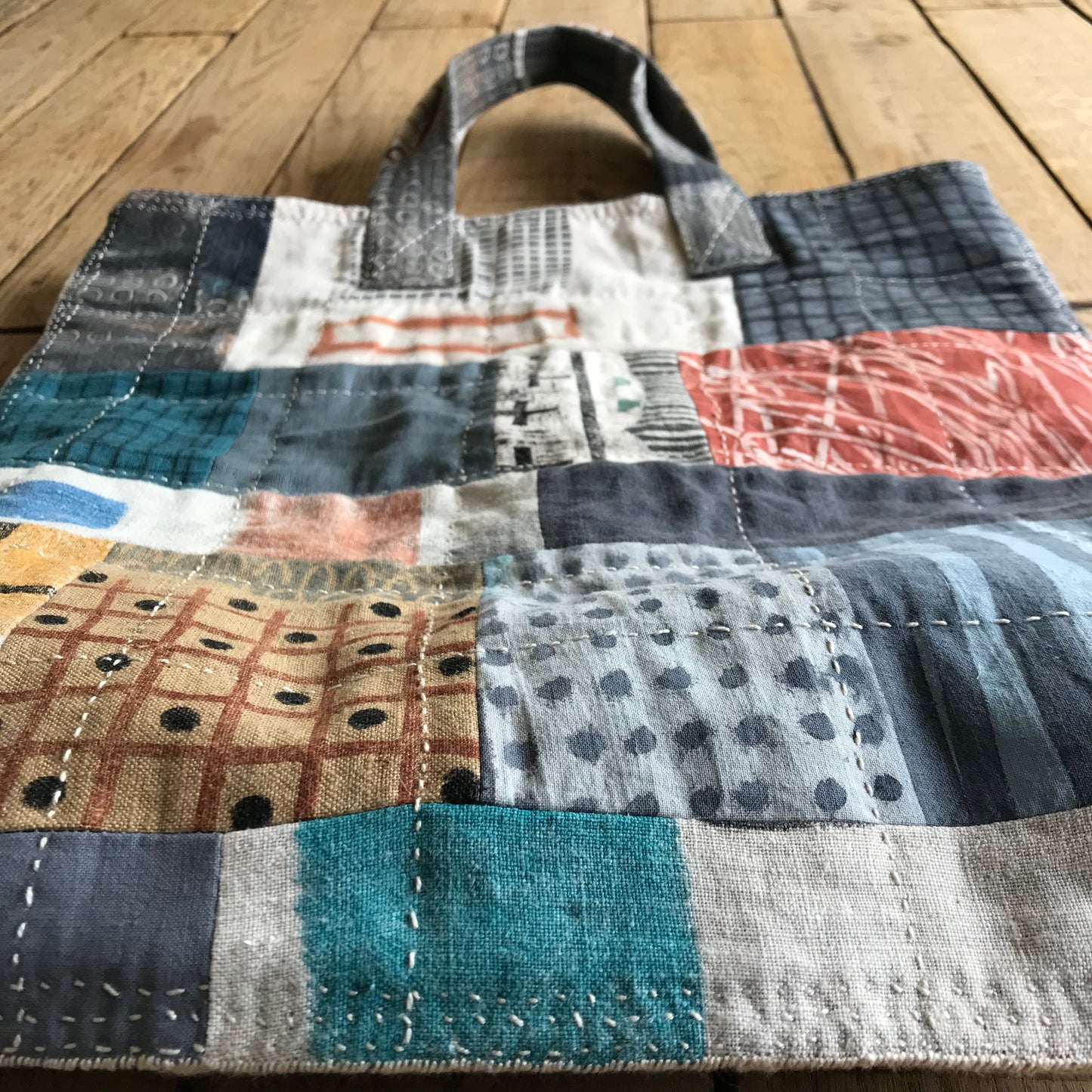 the PATCH WORK GRID WORK bag