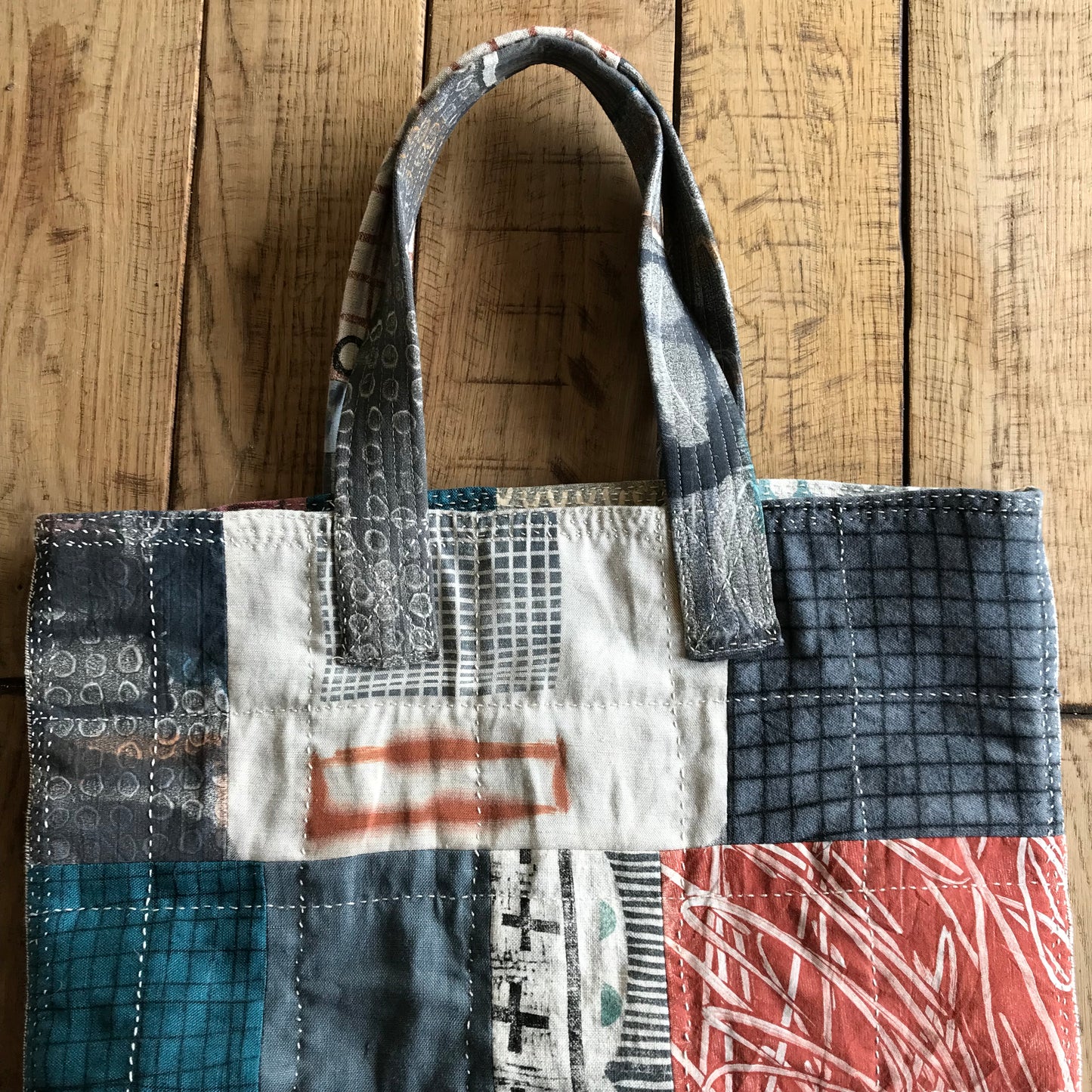 the PATCH WORK GRID WORK bag