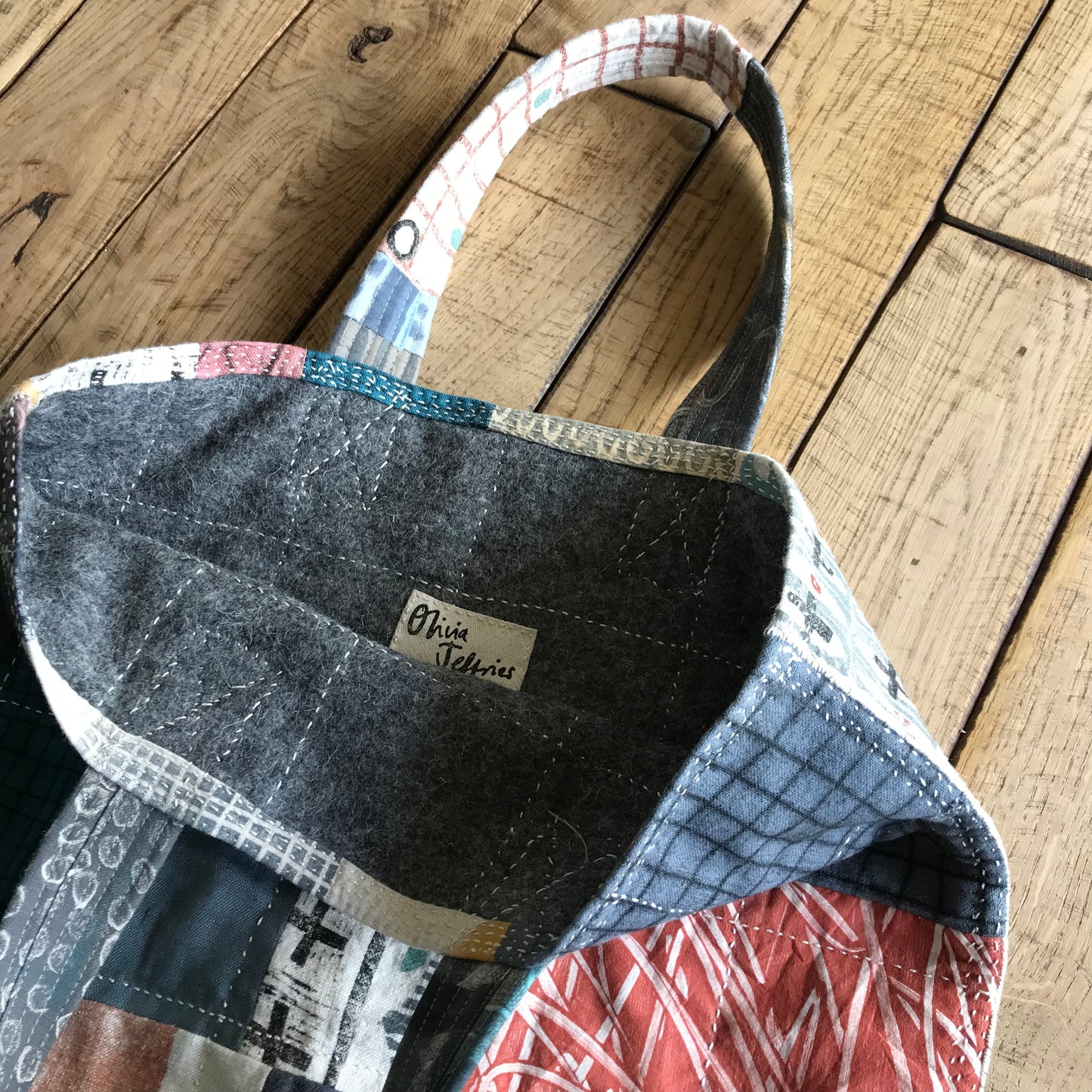 the PATCH WORK GRID WORK bag