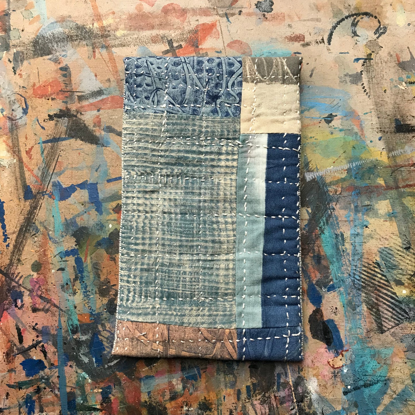 the SLIM PATCHWORK pouch with silver buckle