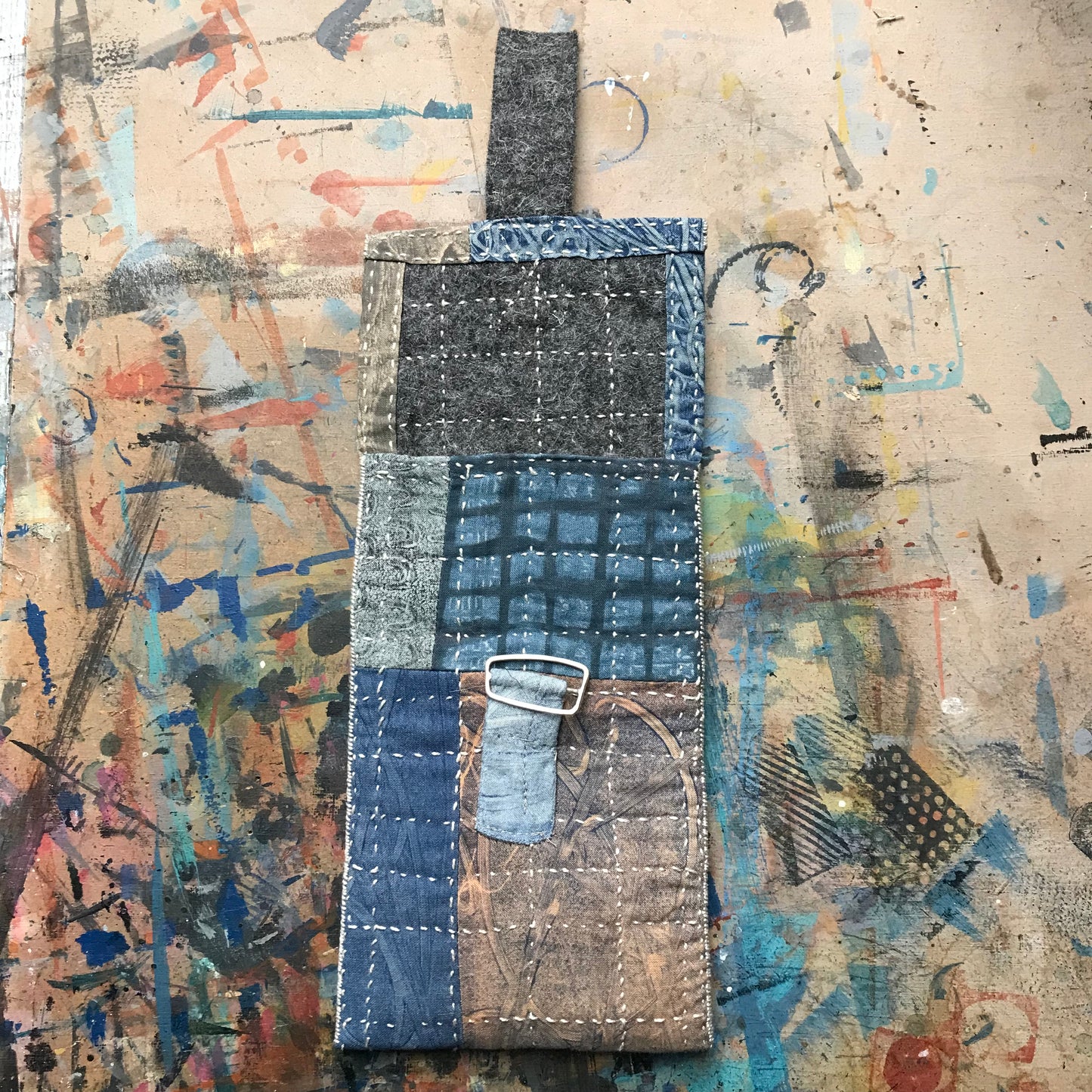 the SLIM PATCHWORK pouch with silver buckle