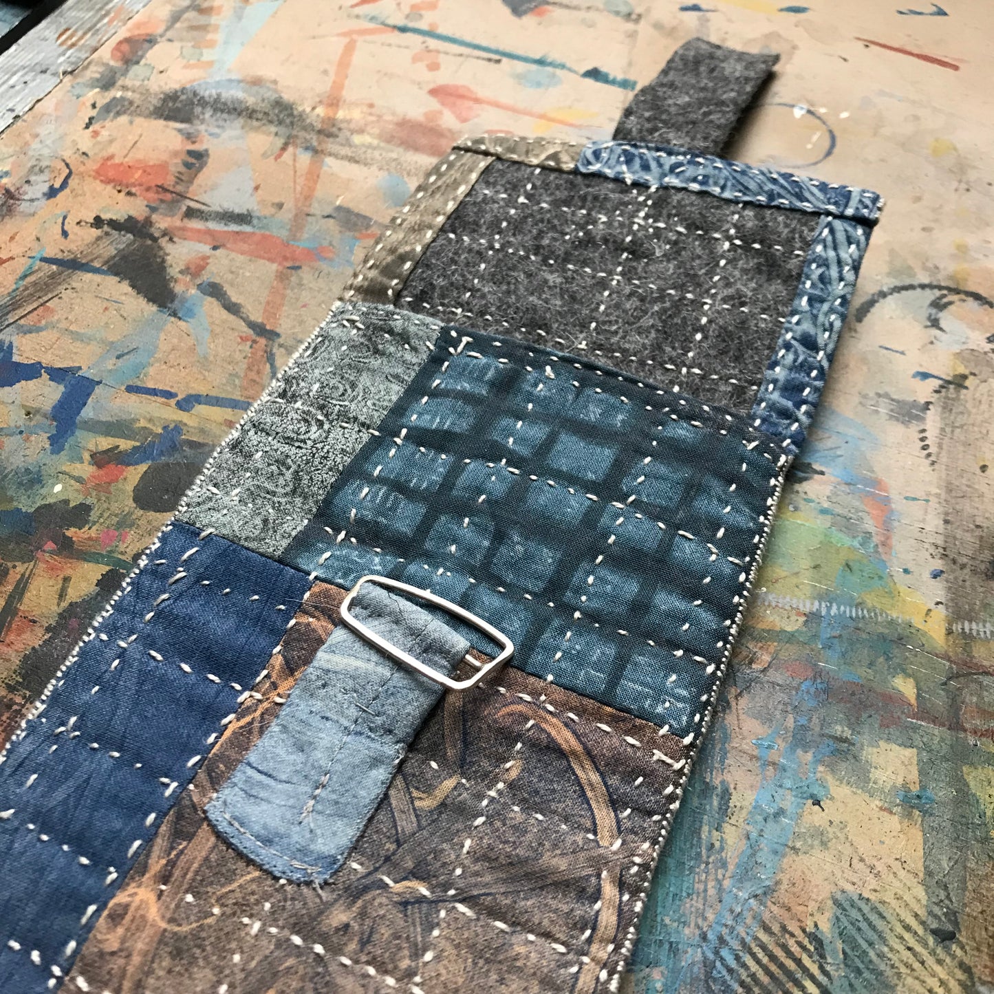 the SLIM PATCHWORK pouch with silver buckle
