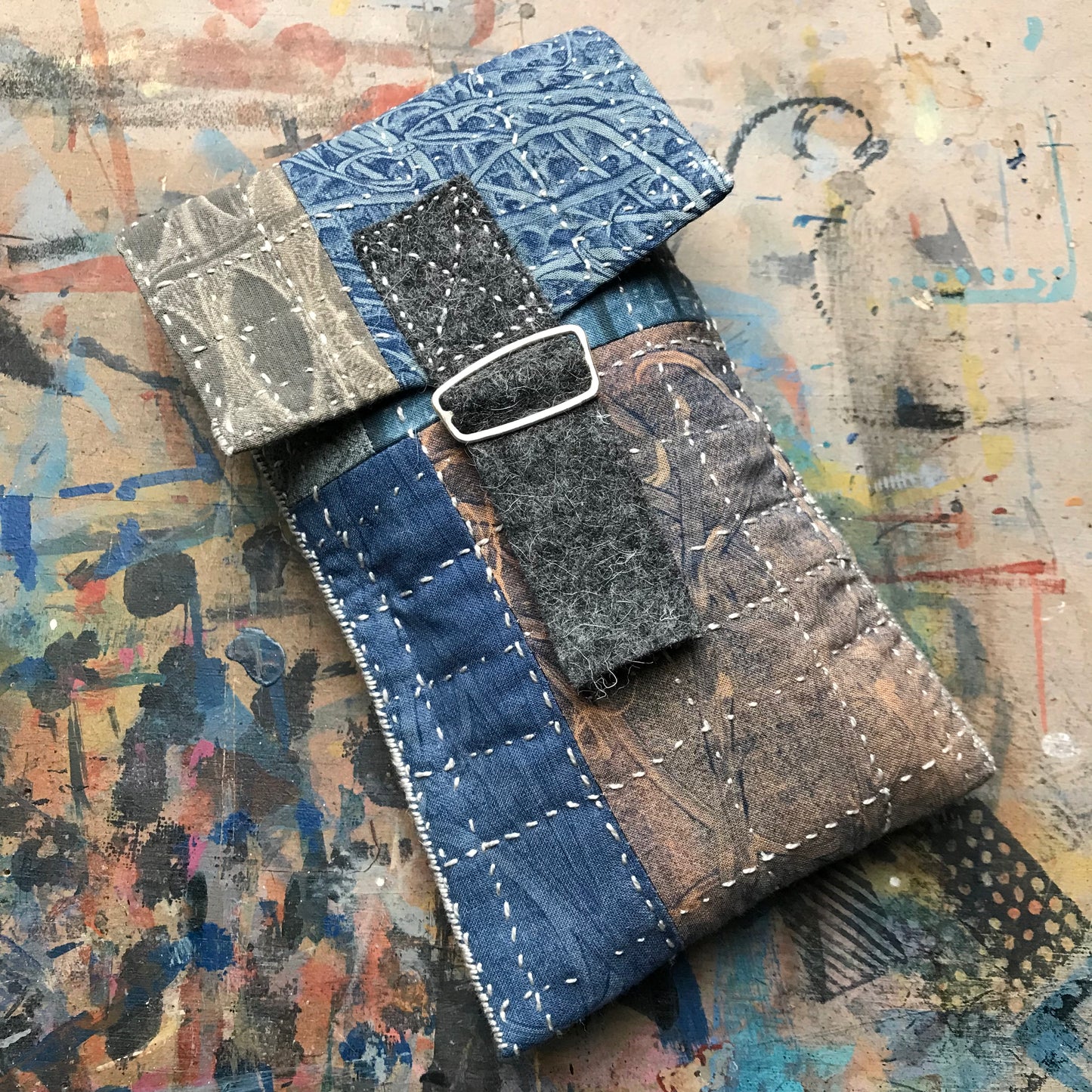 the SLIM PATCHWORK pouch with silver buckle