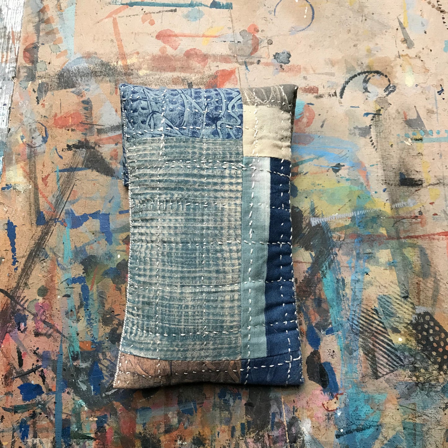 the SLIM PATCHWORK pouch with silver buckle