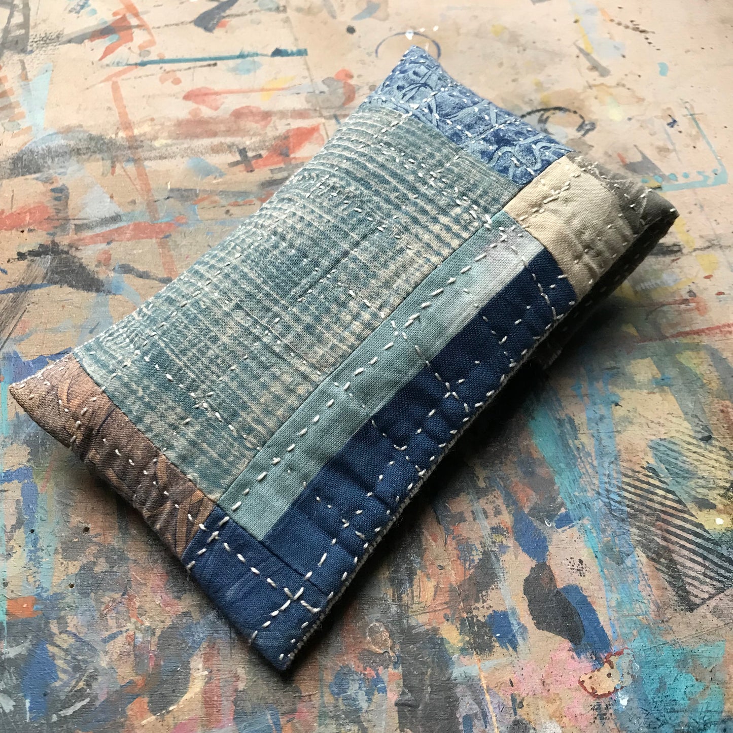 the SLIM PATCHWORK pouch with silver buckle